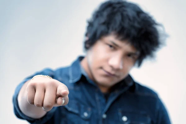 Young Man Blue Denim Shirt Extends Pointing Finger His Hair — Stock Photo, Image