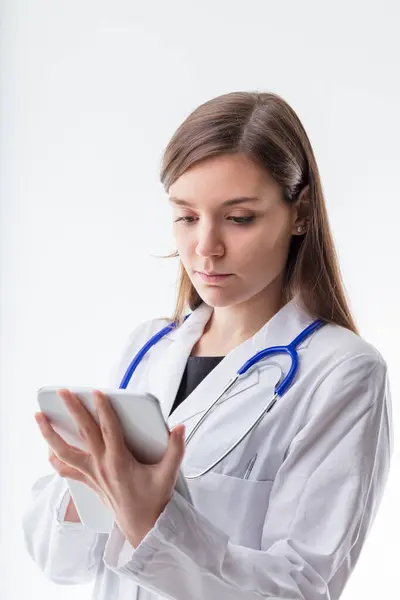 Dedicated Healthcare Worker Meticulously Checks Medical Records Her Device Reflecting — Stock Photo, Image