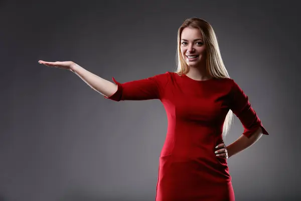 Her Gesture One Balance Precision Arm Extended Sleek Red Dress — Stock Photo, Image