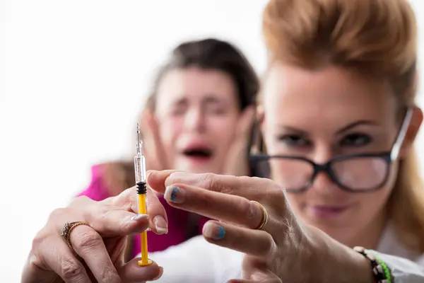 Medical Professional Carefully Handles Needle While Patient Reacts Shock Fear — Stock Photo, Image