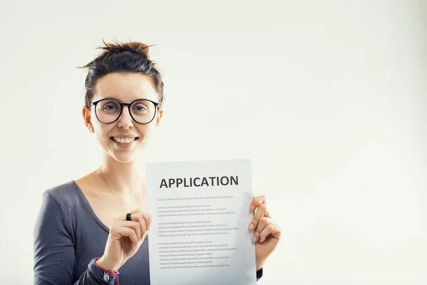Optimistic Woman Proudly Presents Application Form Symbolizing Step New Beginnings — Stock Photo, Image