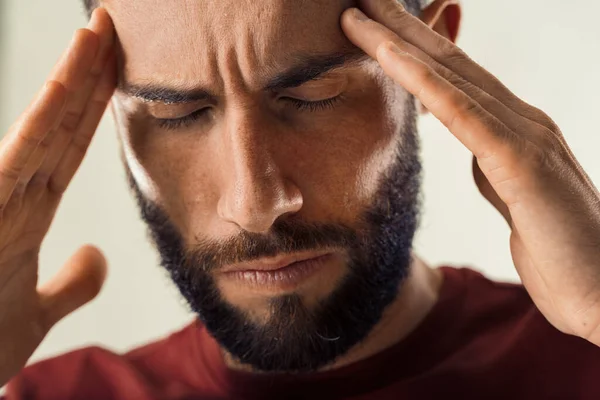 Man Pained Expression Touches His Forehead Showing Signs Stress — Stock Photo, Image