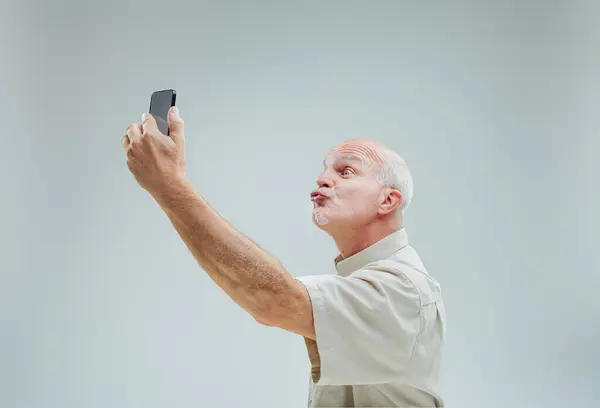 Man Cheerful Expression Sends Virtual Kiss His Raised Phone Suggests — Stock Photo, Image