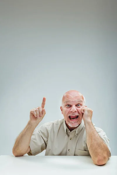 Exuberant Man Points Upward Facial Expression Conveying Sudden Burst Inspiration — Stock Photo, Image