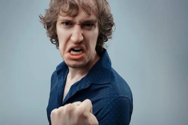 Man Navy Shirt Expresses Intense Anger His Clenched Fist Grimace — Stock Photo, Image