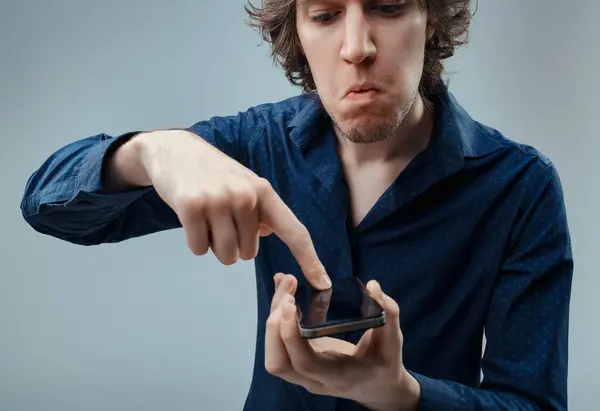 Skeptical Individual Interacts Modern Smartphone Showing Reluctance Doubt Technology Role — Stock Photo, Image