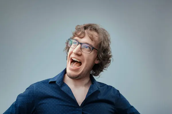 Curly Haired Man Glasses Expresses Overwhelming Joy Mouth Wide Open — Stock Photo, Image