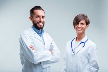 Medical team members stand proudly, their professional attire and stethoscopes indicating a readiness to serve clipart