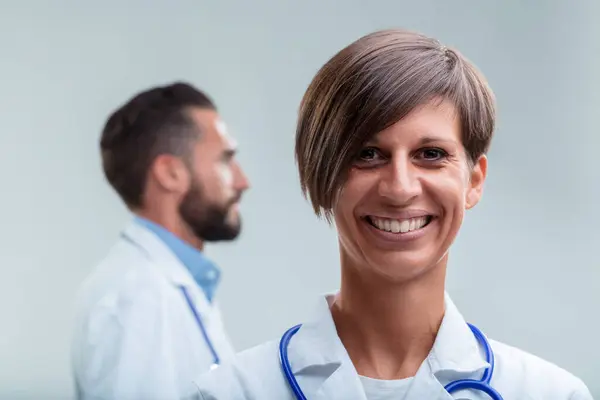 Female Healthcare Professional Stands Forefront Her Welcoming Smile Suggesting Expertise — Stock Photo, Image