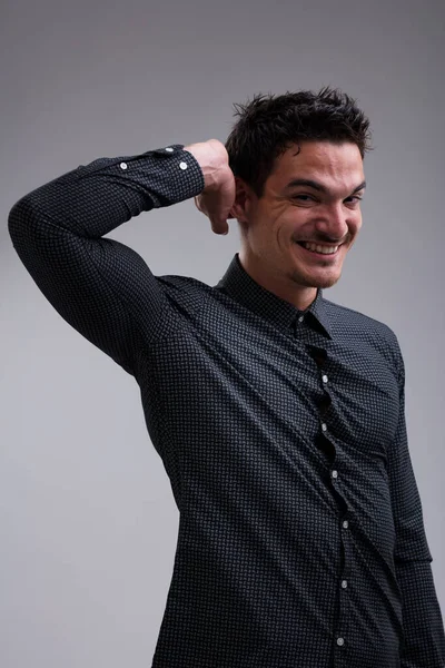 Thoughtful Man Short Haired Wearing Long Sleeved Dark Shirt Smiles — Stock Photo, Image