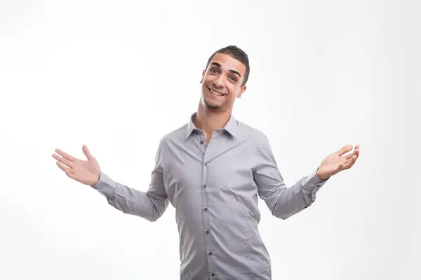 Man Gray Shirt Shrugs Playful Unsure Expression Bright Background — Stock Photo, Image