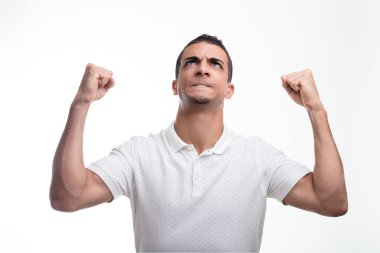 Beaming with pride, he raises clenched fists, embodying the sweet taste of success clipart