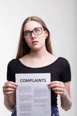 Bored professional stares at complaints, exasperation from problems palpable clipart