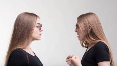 Identical women engage in a silent debate, their expressions locked in communication clipart