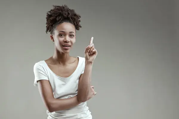 Thoughtful Young Black Woman Gestures Idea Poised White Tee — Stock Photo, Image
