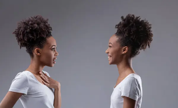 Young Black Woman Whispers Gossip Eliciting Knowing Smile Her Reflection — Stock Photo, Image