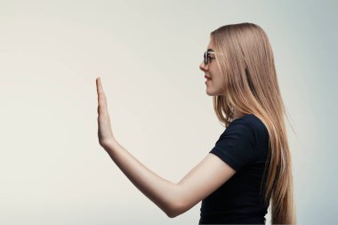 Versatile gesture from a woman, possibly a greeting, high-five, or oath-taking stance clipart