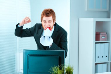 Young businessman shouts encouragements through a megaphone, acting more as a vocal motivator than a hands-on participant clipart