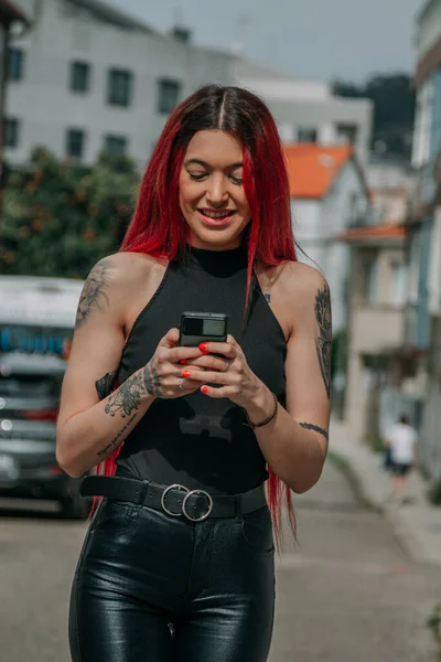 stock image urban woman on the street with mobile phone