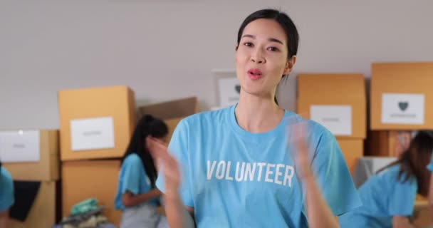 Volunteers Blue Shirts Packing Boxes — Stock Video