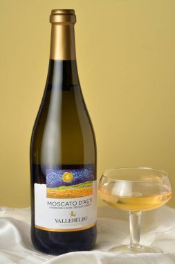 Turin, Piedmont, Italy. -01-12-2023- Bottle and glass of sweet sparkling wine Moscato d'Asti. clipart