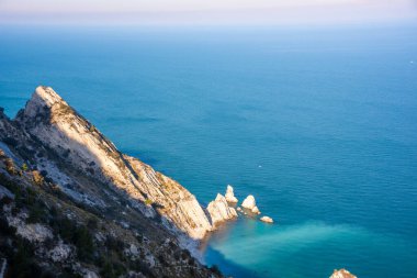 Beautiful rocky coast in blue Mediterranean sea clipart