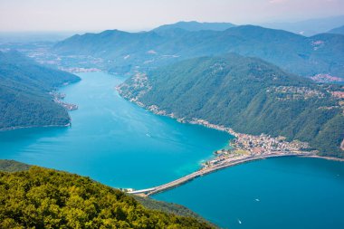 Beautiful big mountain lake with a bridge in Switzerland