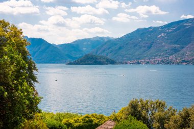 Lake Como. Natural landscape with trees and mountains by lake