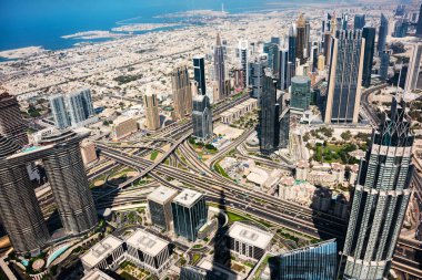 Dubai city seen from above, panoramic view of modern skyscraper buildings