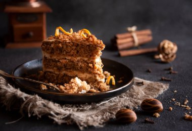 A slice of delicious homeade winter cake with walnus and cinnamon