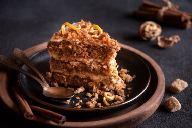 A slice of delicious homeade winter cake with walnus and cinnamon