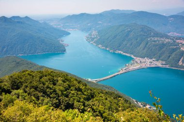 Beautiful big mountain lake with a bridge in Switzerland