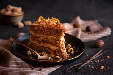 A slice of delicious homeade winter cake with walnus and cinnamon