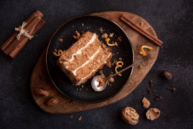 A slice of delicious homeade winter cake with walnus and cinnamon