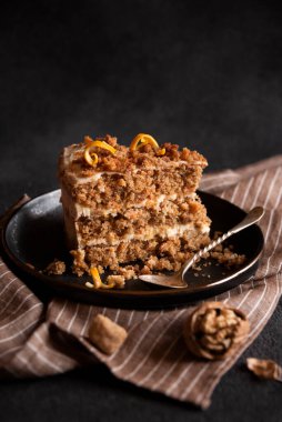 A slice of delicious homeade winter cake with walnus and cinnamon