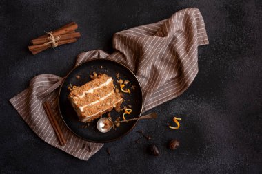 A slice of delicious homeade winter cake with walnus and cinnamon