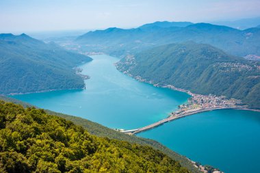 Beautiful big mountain lake with a bridge in Switzerland