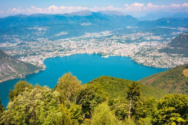 Beautiful big mountain lake with a bridge in Switzerland