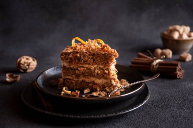 A slice of delicious homeade winter cake with walnus and cinnamon