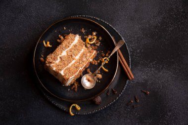 A slice of delicious homeade winter cake with walnus and cinnamon