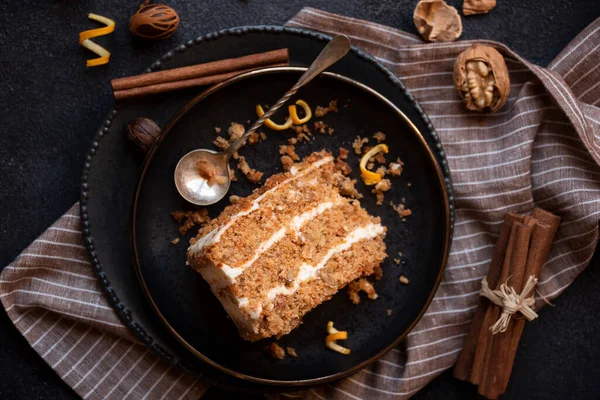 A slice of delicious homeade winter cake with walnus and cinnamon