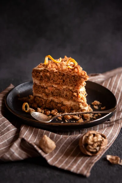 A slice of delicious homeade winter cake with walnus and cinnamon