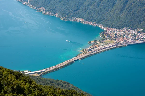 Stock image Beautiful big mountain lake with a bridge in Switzerland