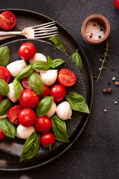 Caprese salad with mozzarella cheese and tomatoes of Italy cuisine
