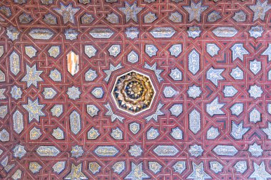 Elaborate arabesque patterns adorn Alhambra Nasrid Palaces ceiling, showcasing Islamic artistry clipart