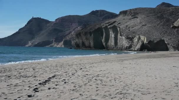 Panning Left Right Blue Mediterranean Sea Beach Sunlit Hills Blue — Stock Video