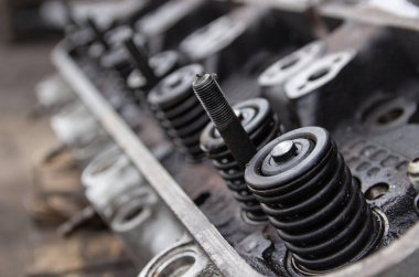 The car's head is disassembled and needs repair. Valve adjustment