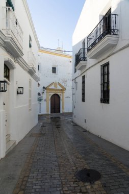 Beautiful street in the historical center of the white beautiful village of Vejer de la Frontera in a sunny day, Cadiz province, Andalusia, Spain