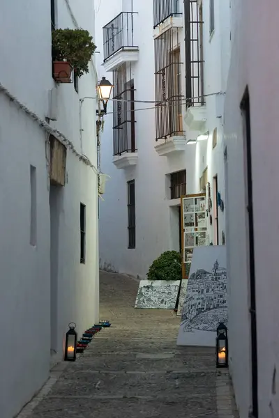 stock image VEJER DE LA FRONTERA, SPAIN - JULY 08, 2022: Beautiful street in the historical center of the white beautiful village of Vejer de la Frontera at twilight, Cadiz province, Andalusia, Spain