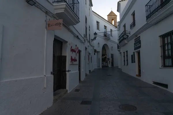 stock image VEJER DE LA FRONTERA, SPAIN - JULY 09, 2022: Beautiful street in the historical center of the white beautiful village of Vejer de la Frontera at sunrise, Cadiz province, Andalusia, Spain
